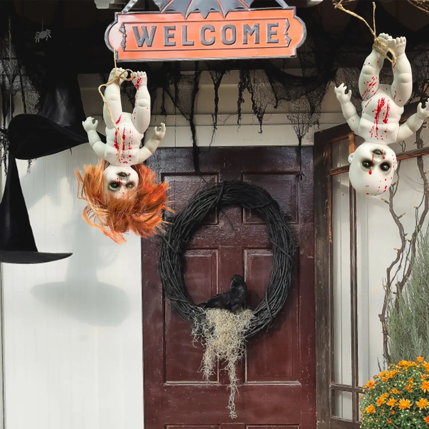 two hanging halloween ghost doll spooky props with white plastic bodies red fake blood splatters one with orange hair and the other bald