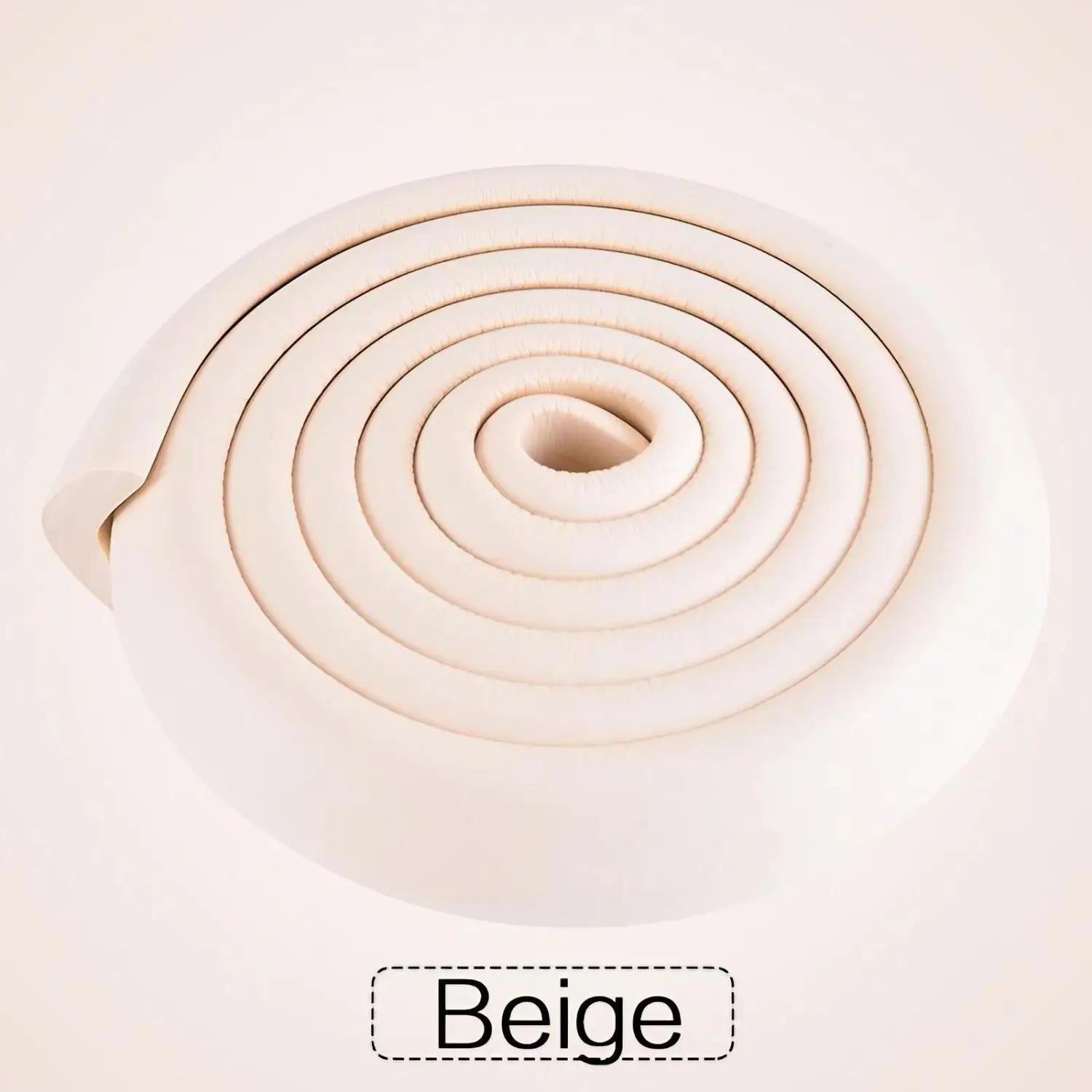 Beige foam safety bumper strip coiled into a spiral shape with thick l shape guard and rounded edges for child protection.