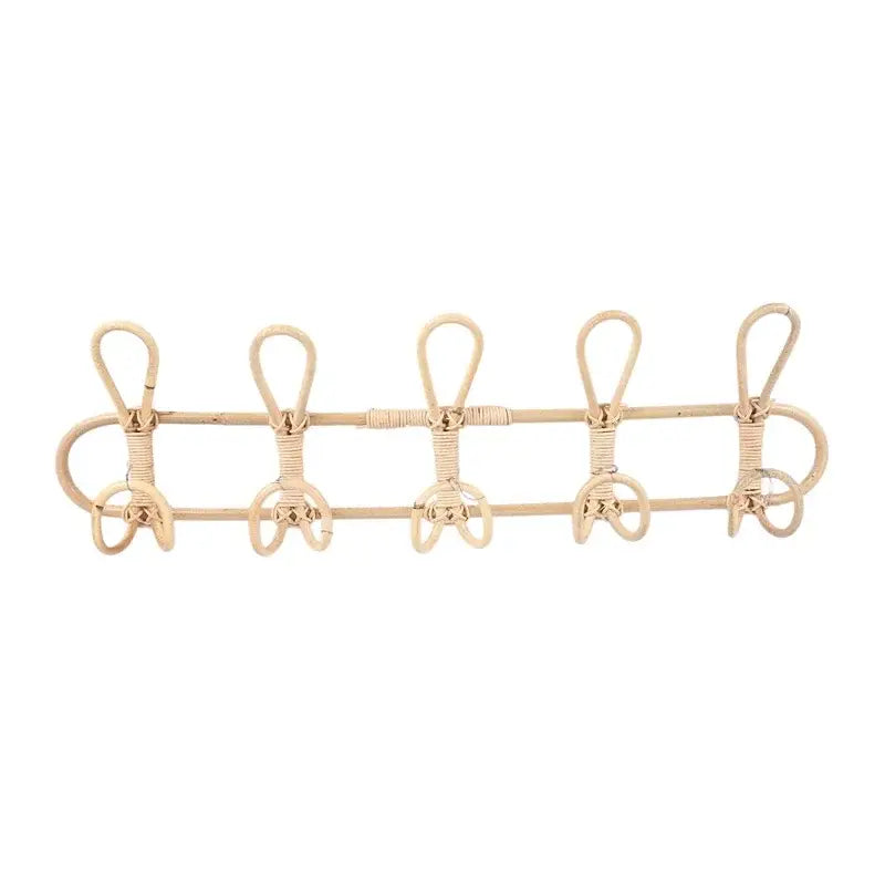 Natural-toned rattan wall-mounted coat rack with five evenly spaced hooks for kids wall hanger organizer.