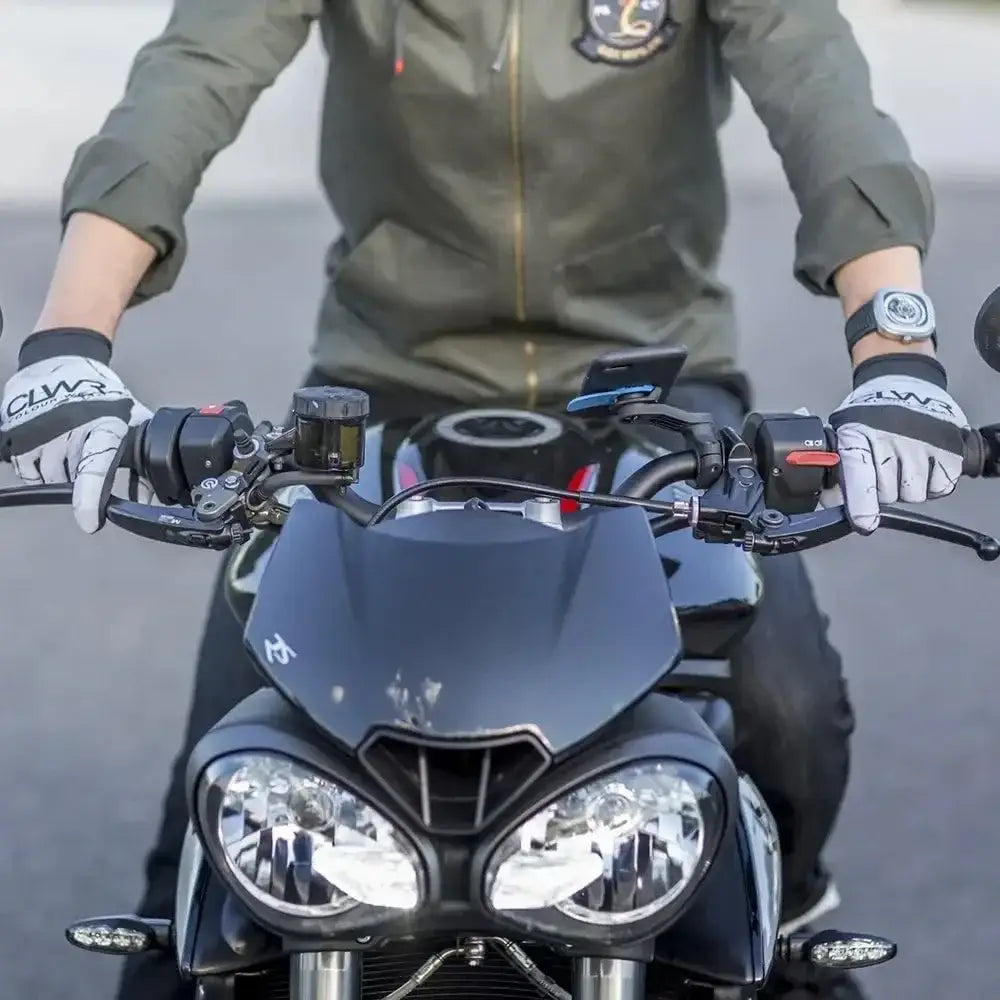 Black matte-finished motorcycle featuring dual round headlights and a sleek modern design alongside a universal bike phone mount with 360 rotation.