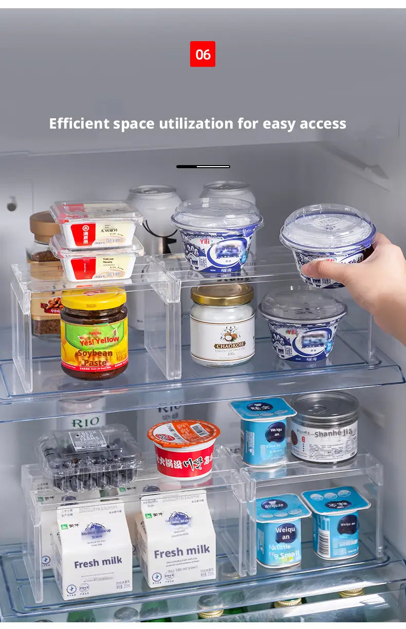 Clear expandable cabinet organizer and spice rack with clear plastic transparent stackable compartments holding various food items like yogurt and soybean paste.