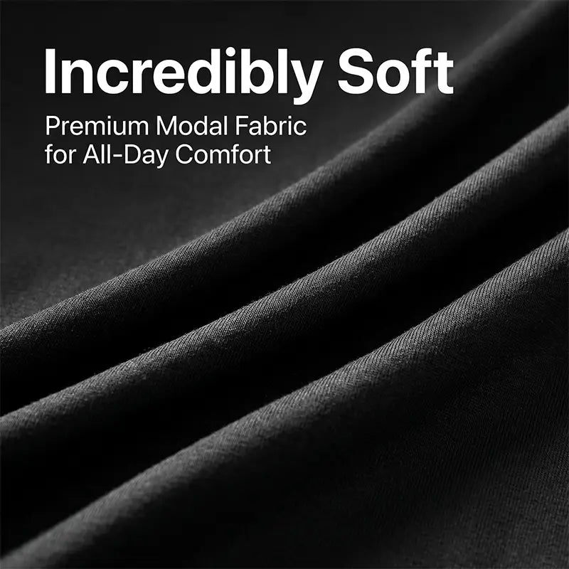 black premium modal fabric with a smooth softly textured surface used in a women’s short sleeve t-shirt featuring a Halloween dog graphic.