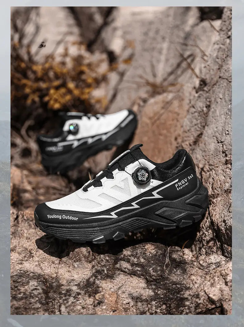 Men hiking shoes in white and black featuring a distinctive circular dial closure system designed for waterproof, lightweight trekking and outdoor use.