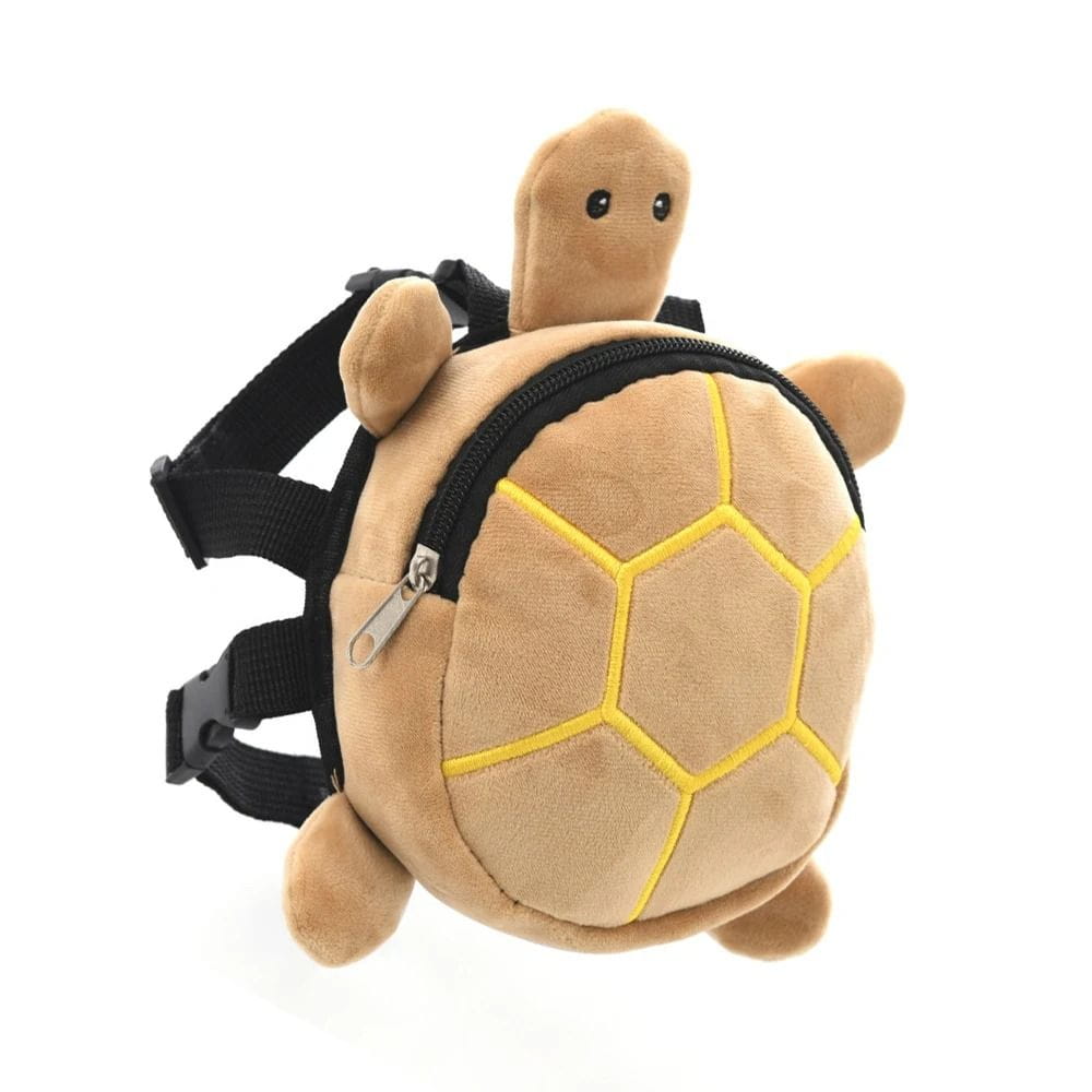tan plush turtle shape dog backpack featuring yellow stitched shell segments and black adjustable straps for pet carrying