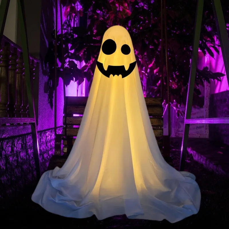 a glowing yellow lighted standing halloween witch hat ghost decor made of translucent inflatable material with black circular eyes and a smiling mouth