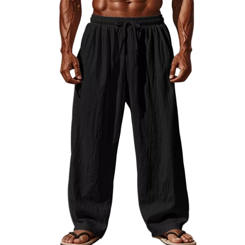 black loose-fitting linen pants with an elastic waistband and drawstring designed for men casual wear in cotton linen blend