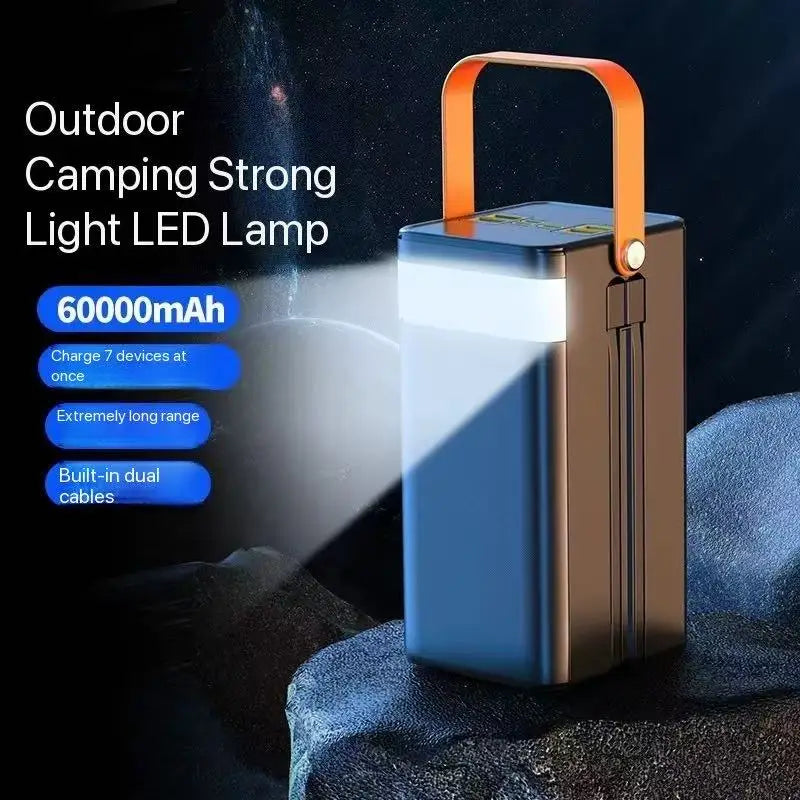 A sleek rectangular 60000mah portable power bank fast charging station with a matte black and bronze finish, featuring an orange handle and micro input 5v2a for convenient outdoor use.