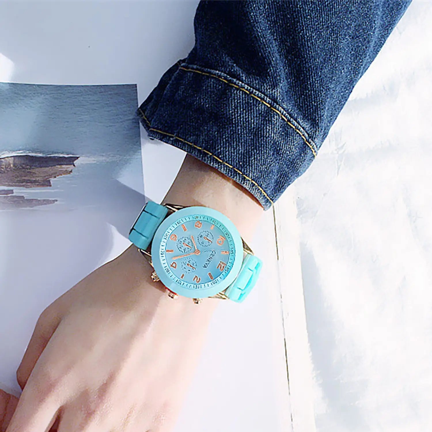 A women silicone quartz watch fashion chronograph with a turquoise silicone strap, gold-tone case, and matching dial featuring multiple subdials.