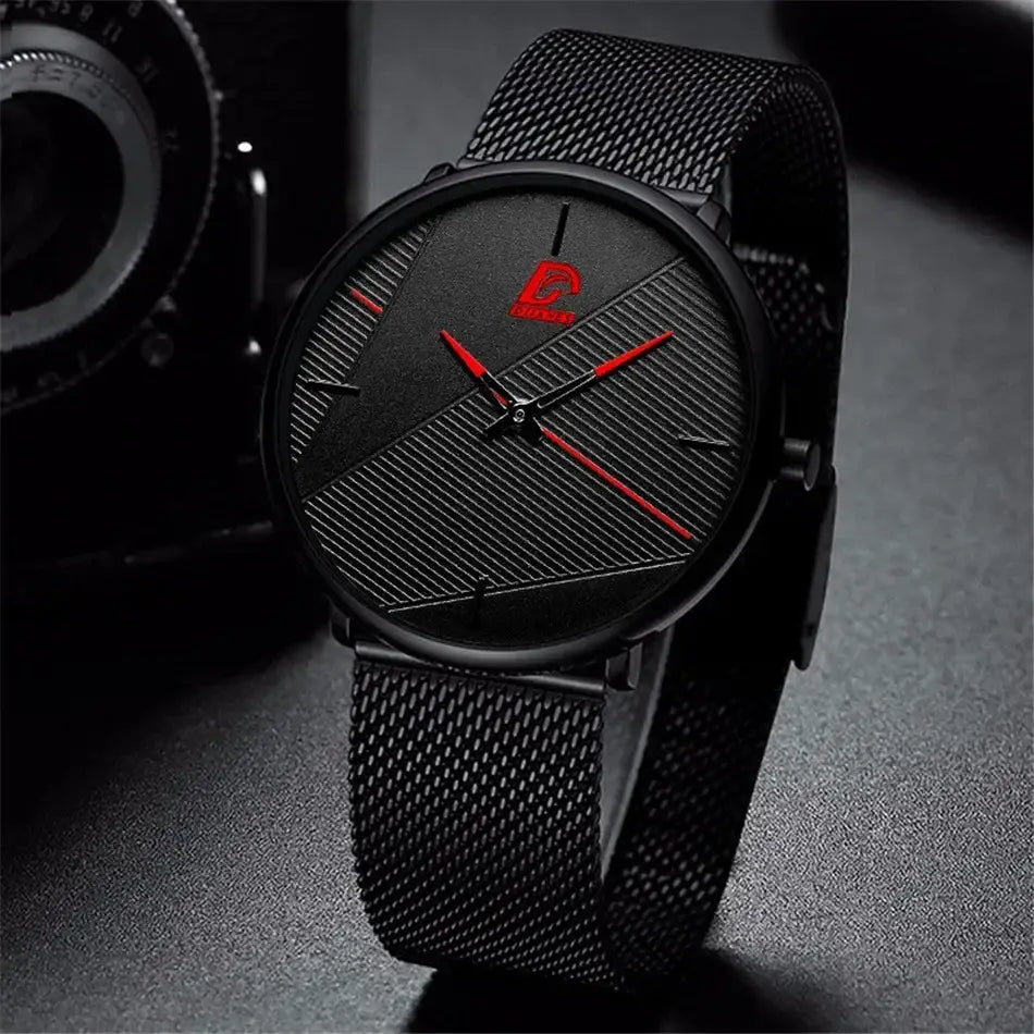 Herrenarmbanduhr aus schwarzem Mesh, Quarz, mit einem eleganten, modernen Design: kräftige rote Zeiger und ein dezentes diagonales Streifenmuster auf dem Zifferblatt.