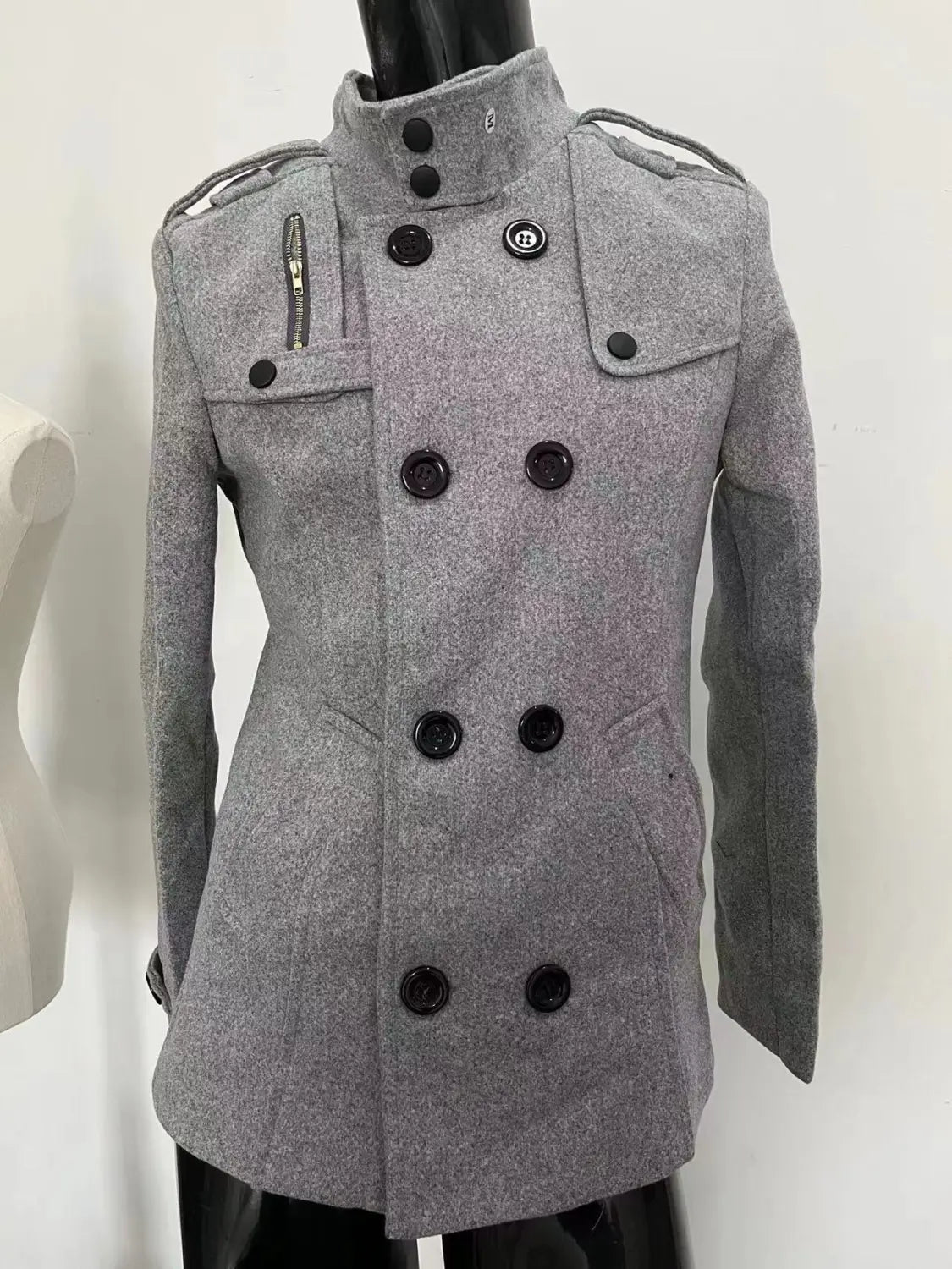 gray woolen double breasted warm woolen coat for men featuring black buttons and shoulder straps