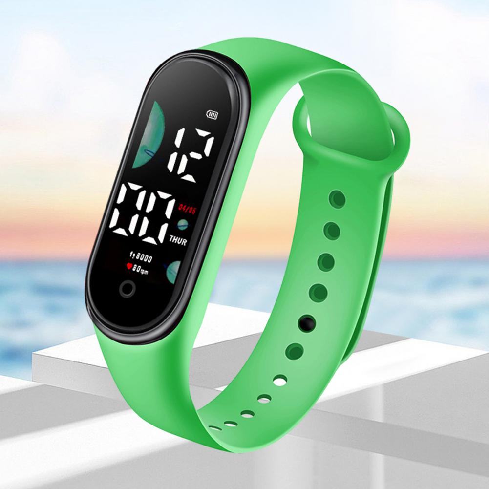 Bright green silicone electronic watch with a black large font screen digital display showing time and date, designed as a waterproof digital sports watch.