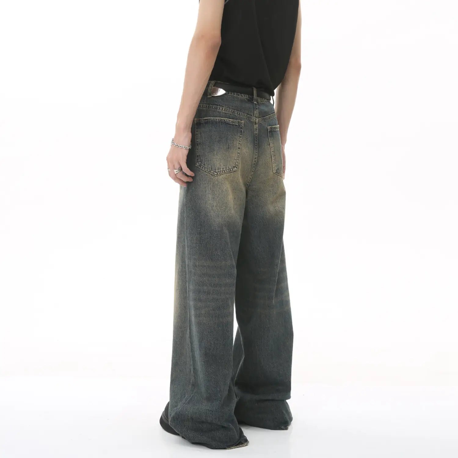 Men’s vintage wide-leg baggy denim jeans in dark wash with a faded and distressed look made of denim material.