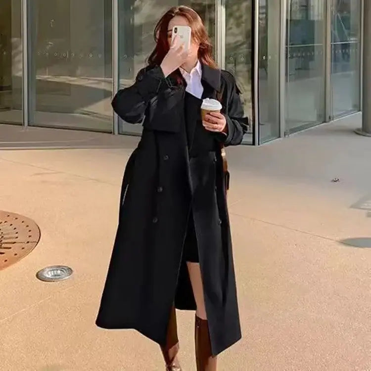 Black women double-breasted trench coat with classic collar made of casual windbreaker material.