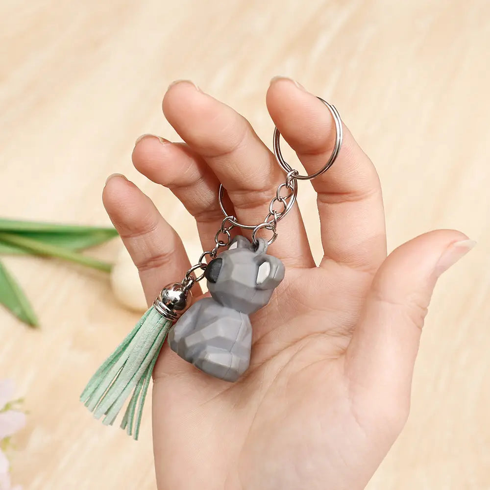 gray geometric cat metal keychain with mint green tassel and silver split ring chain for keys