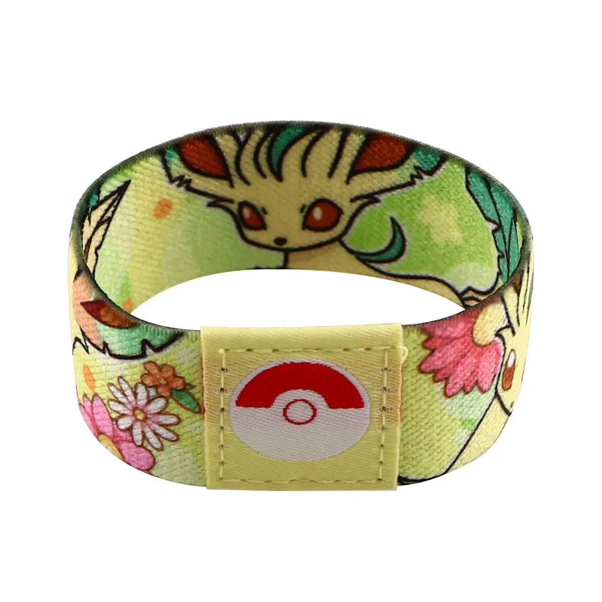 A yellow stretch wristband bracelet made of elastic fabric featuring a colorful print of the Pokémon Eevee surrounded by flowers and leaves with a rectangular patch displaying the red and white Poké Ball logo.