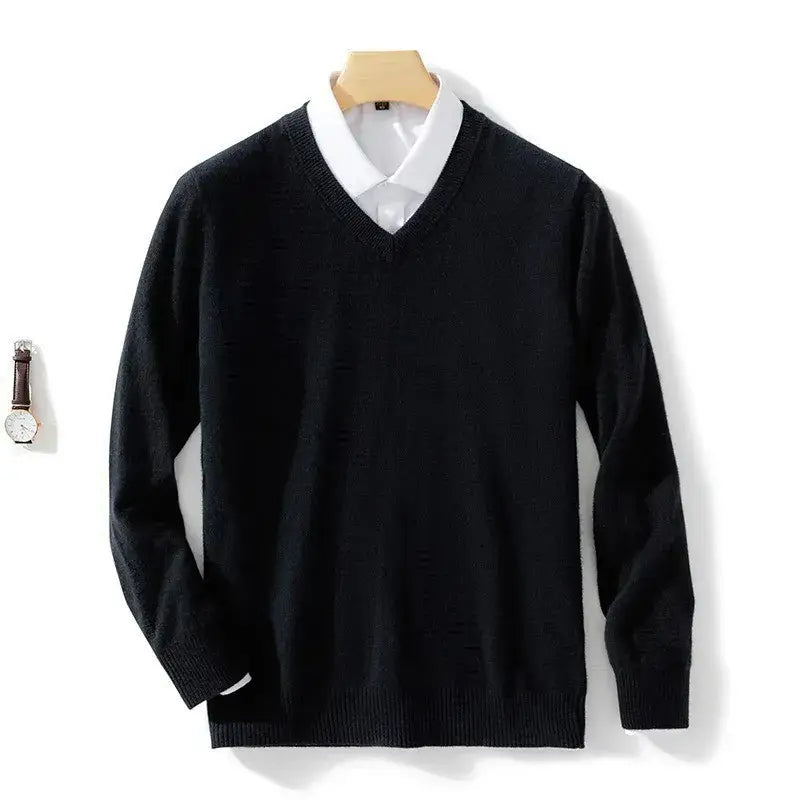 Men cashmere v neck pullover sweater in black with ribbed cuffs and hem worn over a white collared shirt.