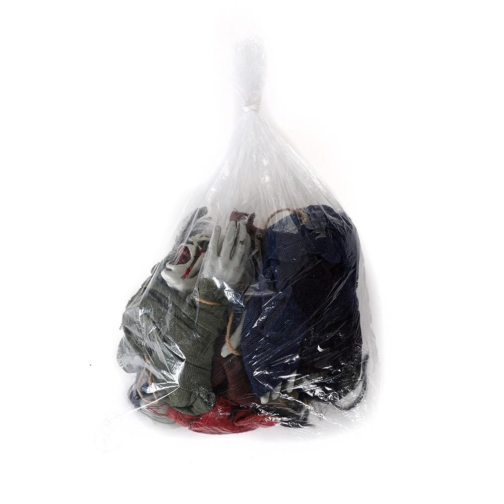A clear plastic bag filled with assorted halloween decorations including a white-faced mask with red accents for hanging creepy scarecrow prop use.