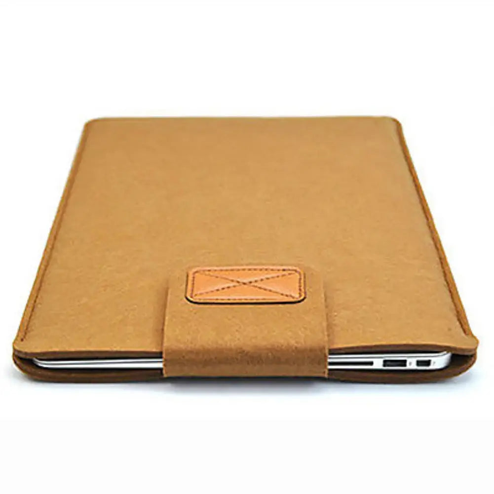 tan leather laptop bag with matching stitched flap and subtle cross-stitch detail designed as a felt sleeve for macbook air and tablet bag use.