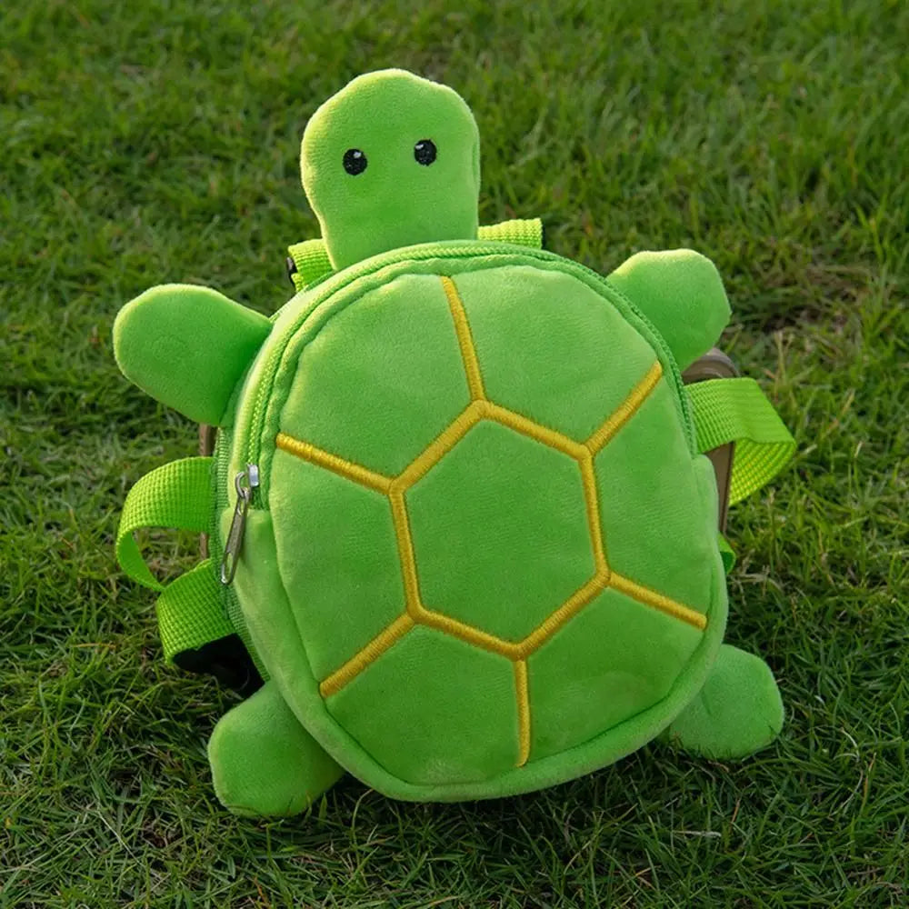 a bright green plush turtle shape dog backpack with yellow embroidered shell patterns and black button eyes designed as a pet carrier