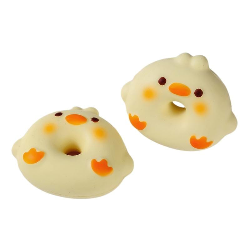 cute cream-colored slow rising toast fidget toys shaped like donuts with orange beaks cheeks and feet designed for stress relief and daily stress reduction and suitable for desktop decoration
