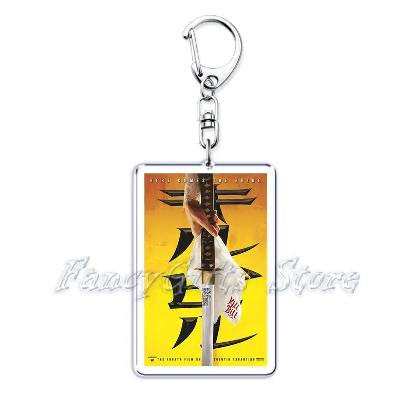 Rectangular acrylic keychain featuring a vibrant yellow and orange movie poster design of kill bill volume 4 with bold black kanji characters from the movie poster acrylic keychain set.