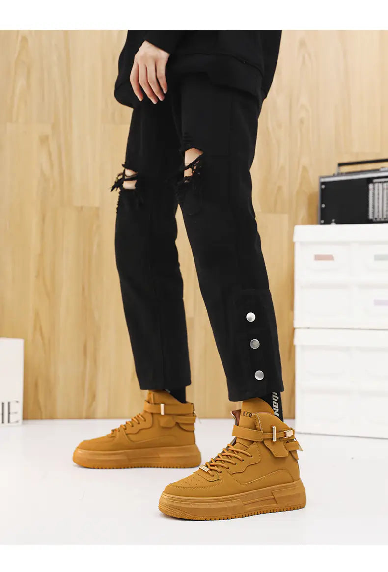 Men white high top sneakers with chunky gold buckle featuring tan leather thick soles and adjustable ankle straps.