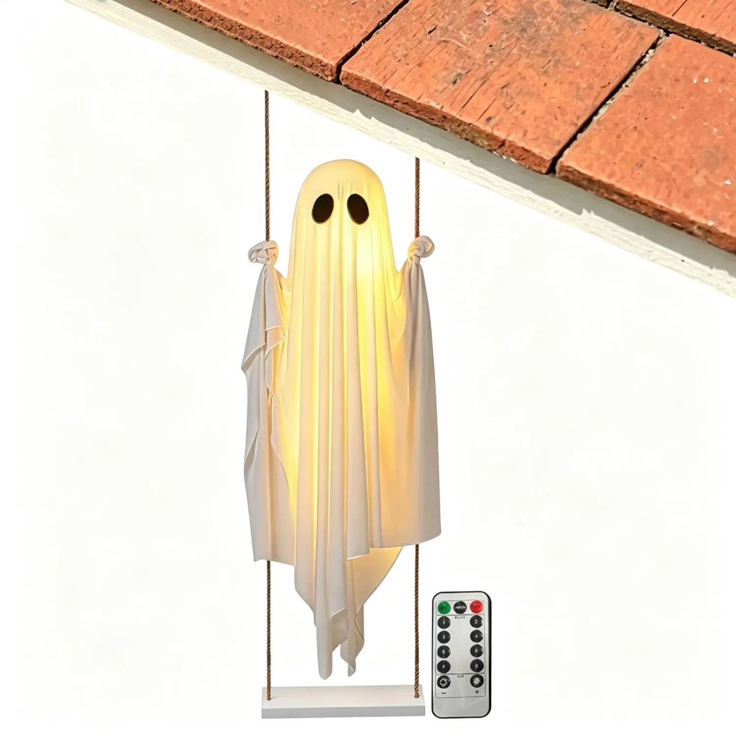 una lámpara con forma de fantasma oscilante blanco luminosa, con tela translúcida en movimiento y recortes negros para los ojos, diseñada como decoración de fantasma para Halloween.