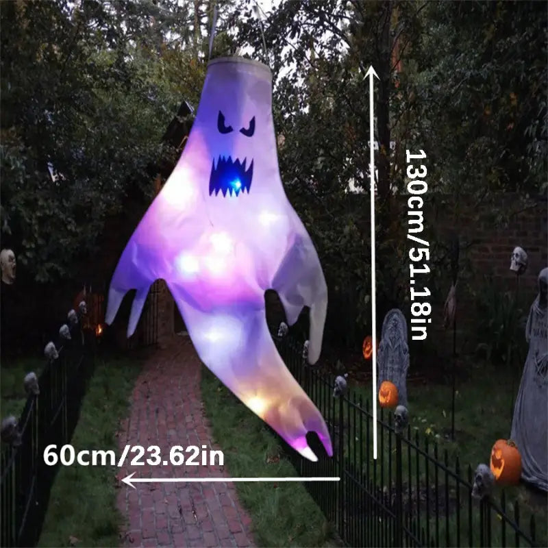 A glowing purple and white inflatable halloween ghost led hanging windsock with a blue led mouth for home outdoor decoration.