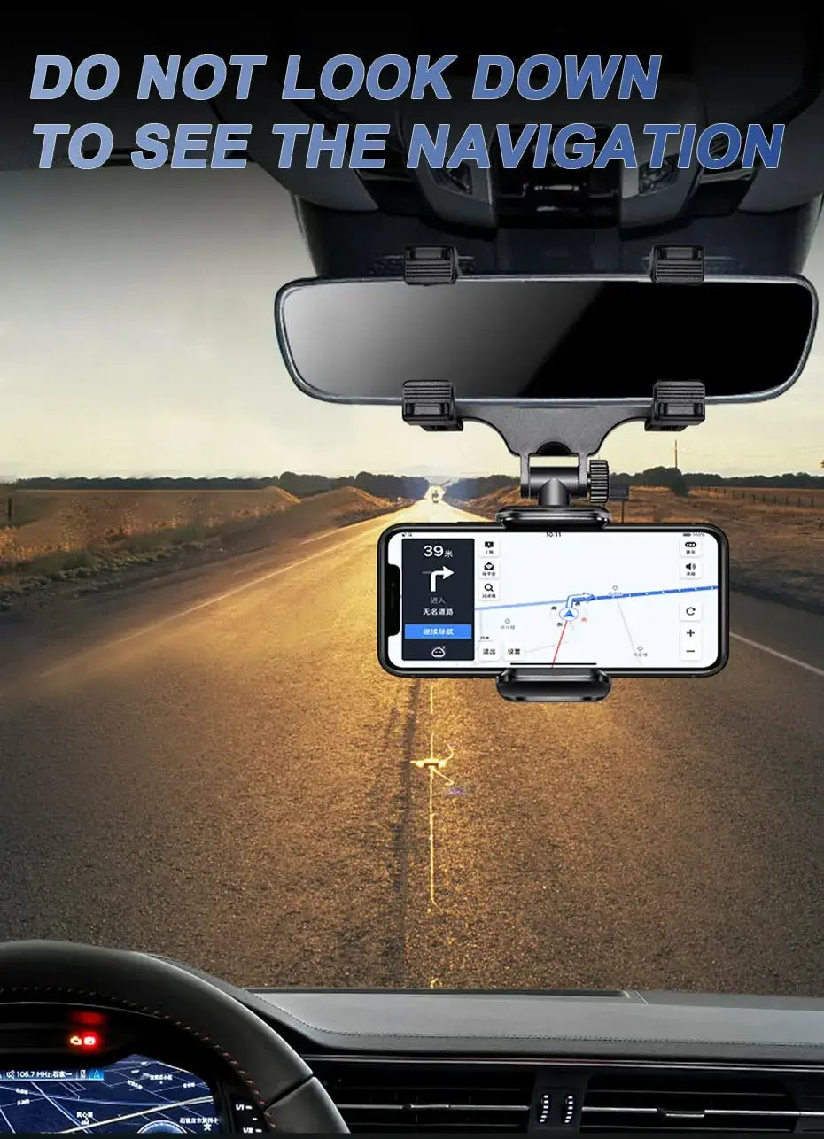 Black smartphone mounted in a 360 degree foldable rearview mirror car phone holder displaying a navigation app on the screen within a car dashboard setup.