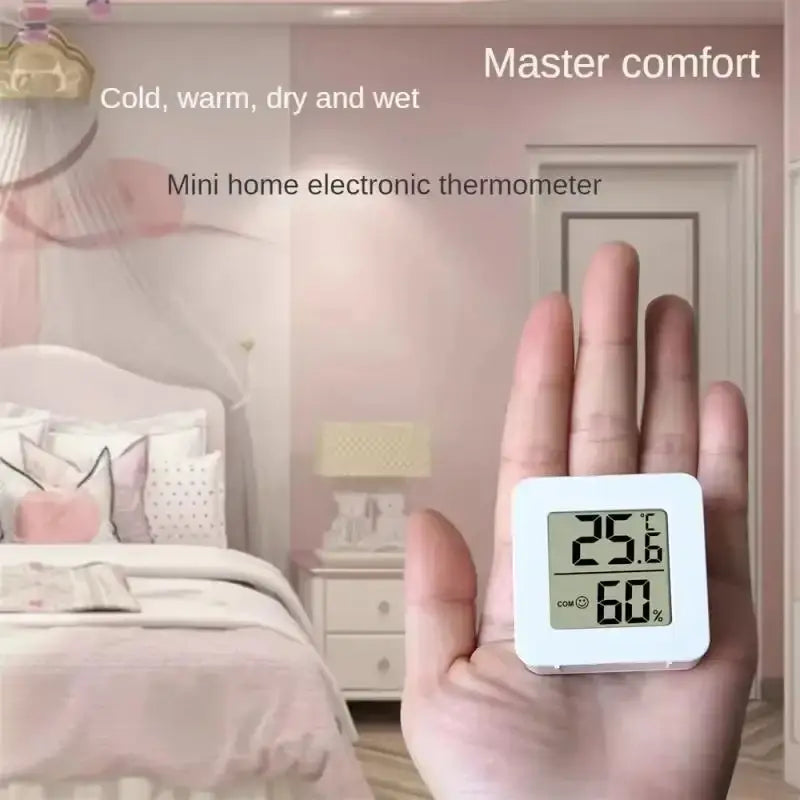 white square digital weather desktop alarm clock displaying temperature of 25.6 degrees celsius and 60 percent humidity on electronic thermometer screen