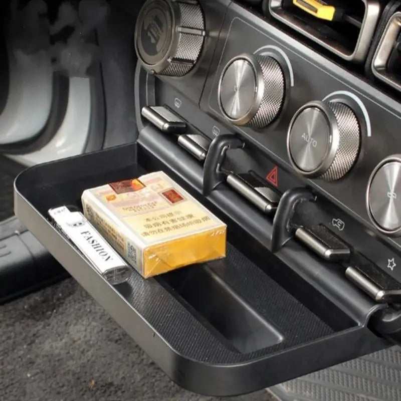 Bandeja organizadora para consola central Icar V23 de plástico negro con ganchos integrados y superficie texturizada para almacenamiento y organización en el vehículo.