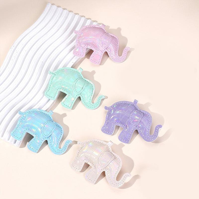 Pastel-colored elephant-shaped pu leather keychain with a glossy crocodile-textured finish and stitched detailing used as a diy animal charm.