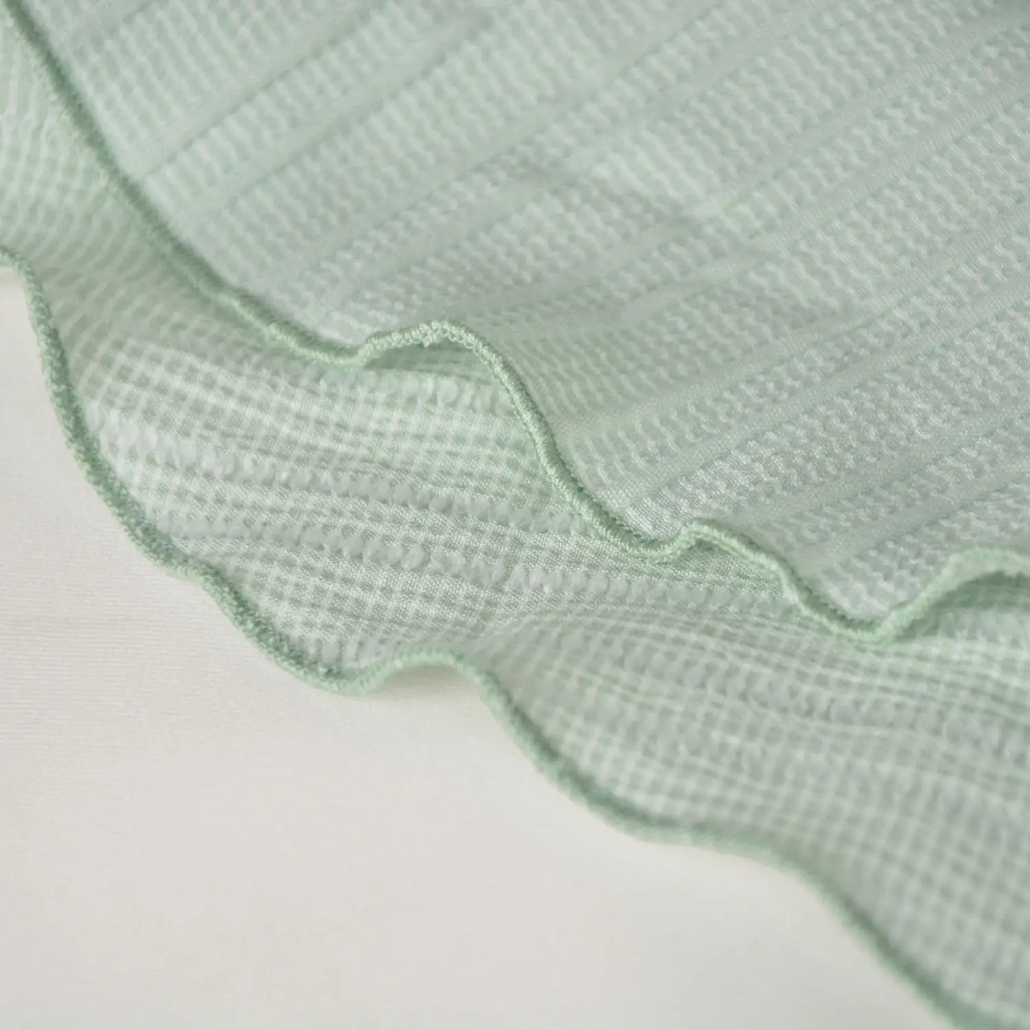 High waist ruffle mini skirt featuring delicate mint green waffle weave fabric with a softly ruffled edge.