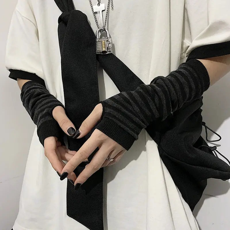 Black ribbed knit fingerless gloves with a subtle striped texture and elastic cuffs designed as striped knit fingerless arm warmers