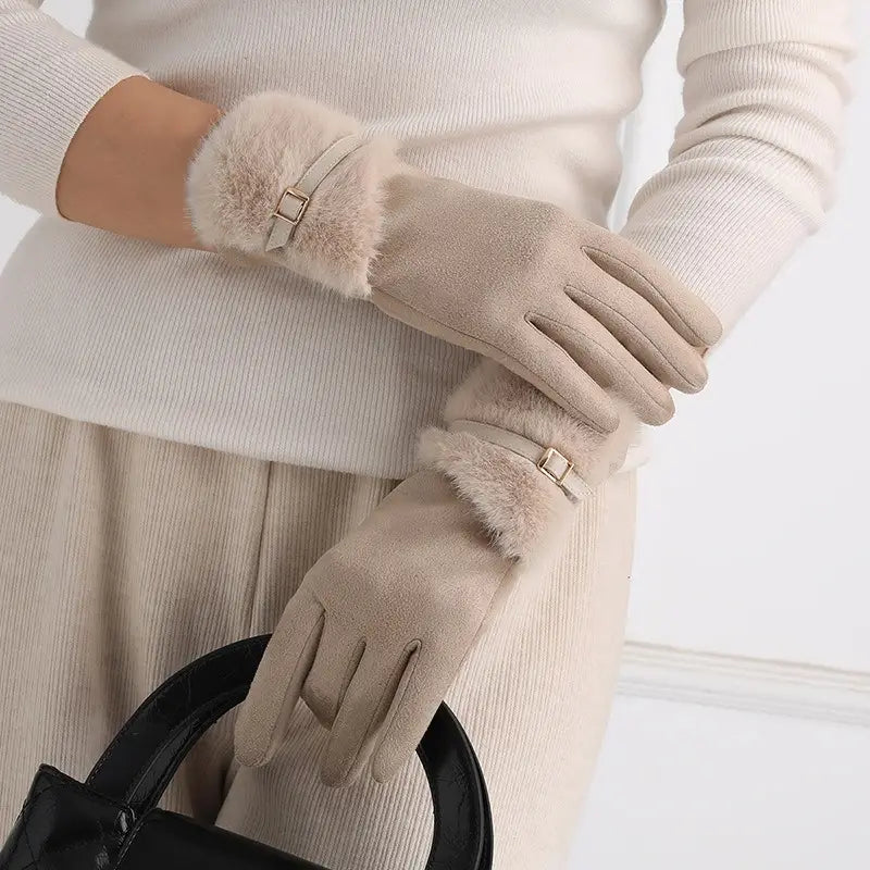 Beige women’s touchscreen winter gloves with a sleek suede exterior, faux fur lining, fleece interior, and gold-tone buckle accents.