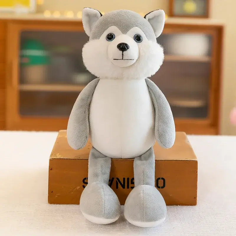 un animal de peluche husky suave gris y blanco, con ojos con botones negros y nariz cosida, incluido en la colección de juguetes blandos de león, elefante y tigre