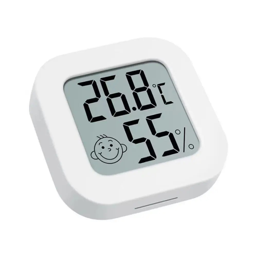 White square digital thermometer and hygrometer room sensor displaying 26.8°c and 55 percent humidity with a smiling face icon and a clear measurement range.