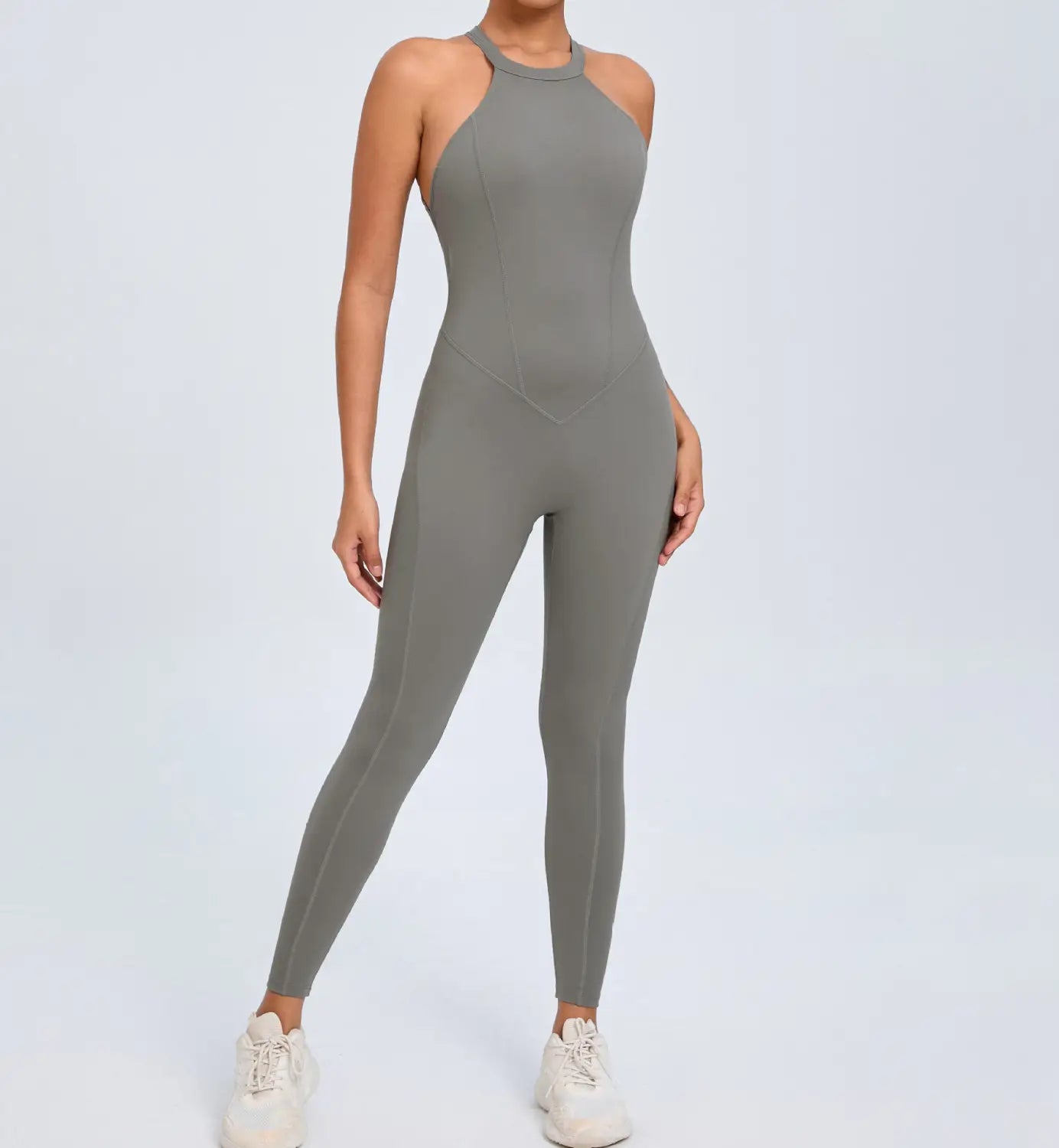 A sleek gray high-necked one-piece athletic jumpsuit with a form-fitting design seamless seams and an open back for workout use.
