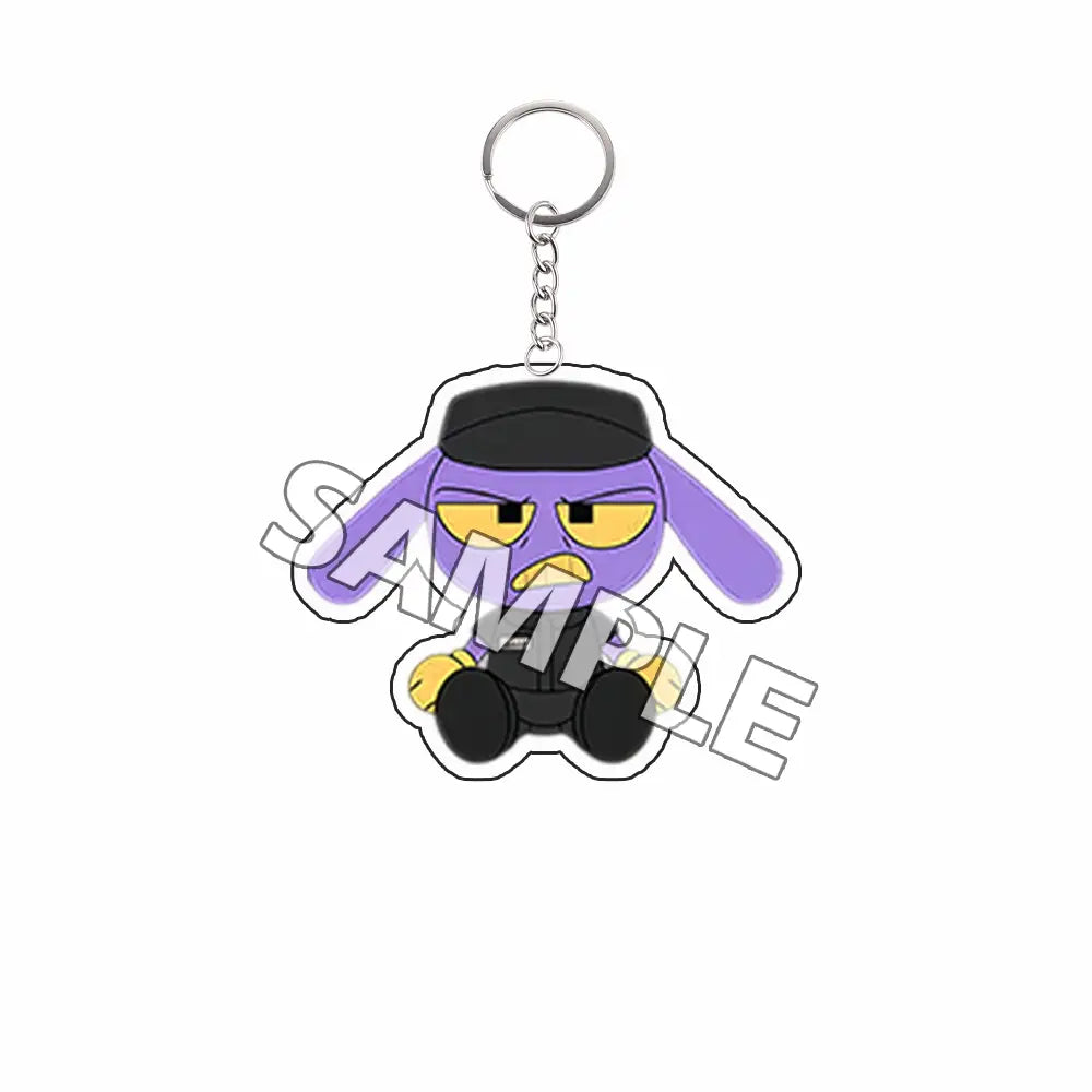 Producto terminado de llavero acrílico que presenta un personaje caricaturesco Tadc morado con sombrero negro y ojos amarillos.