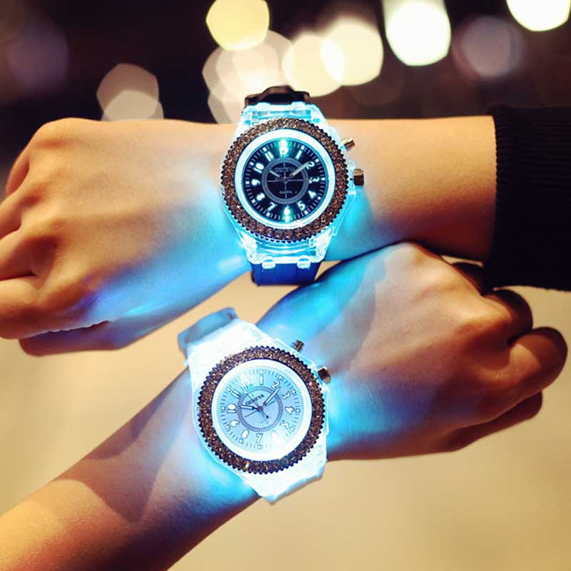 A led luminous silicone watch rhinestone digital timepiece featuring a glowing blue and white LED with a sparkling bezel, one with a black dial and the other with a silver-toned face.