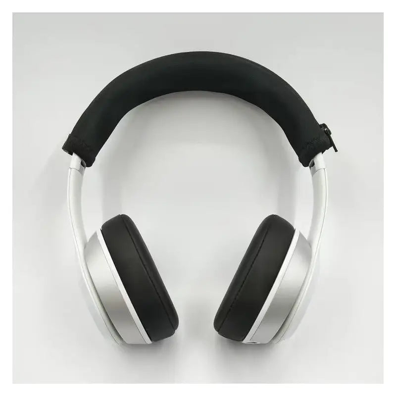 Silver over-ear headphones with black padded neoprene headband and earcups featuring a zipper cushion cover.