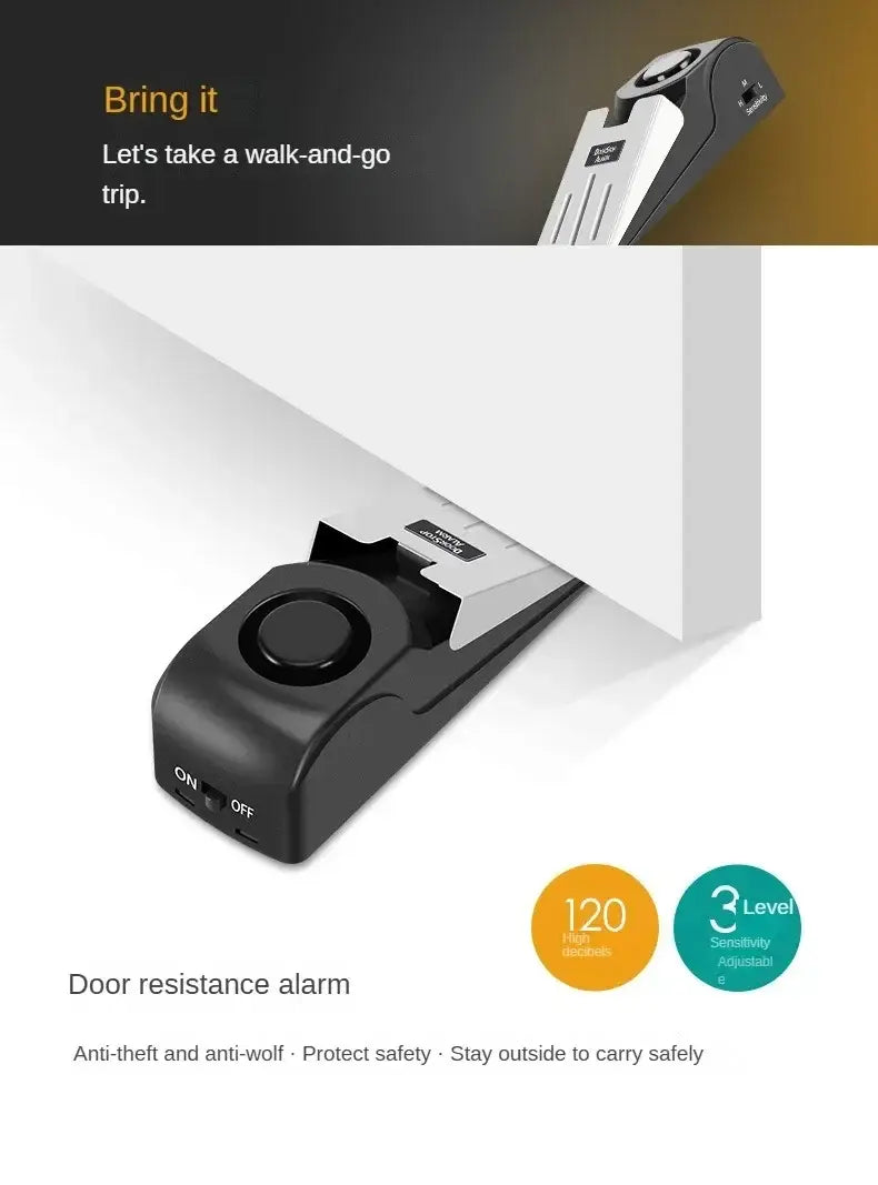 円形ボタン、オン／オフスイッチ、および調整可能な感度設定を備えた、黒色と銀色のドアストッパー防犯アラーム。ドアストッパーのセキュリティおよび警報付きドア保護のために設計されています。