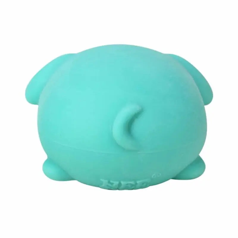 a soft mint-green sensory fidget toy shaped like a round puppy with small ears and a curved tail showcasing quick rebound properties