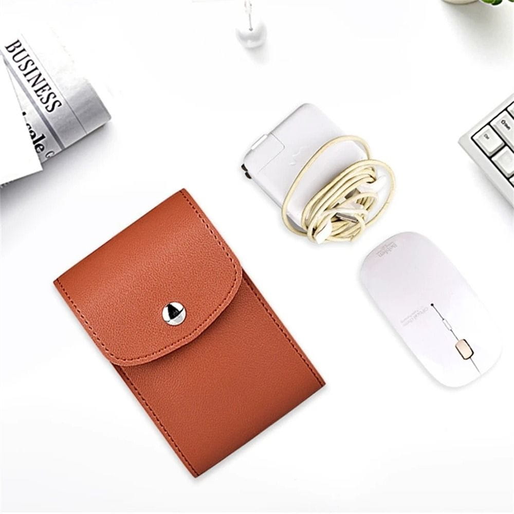brown leather pu digital storage bag with silver button closure designed as a portable cable organizer and card holder