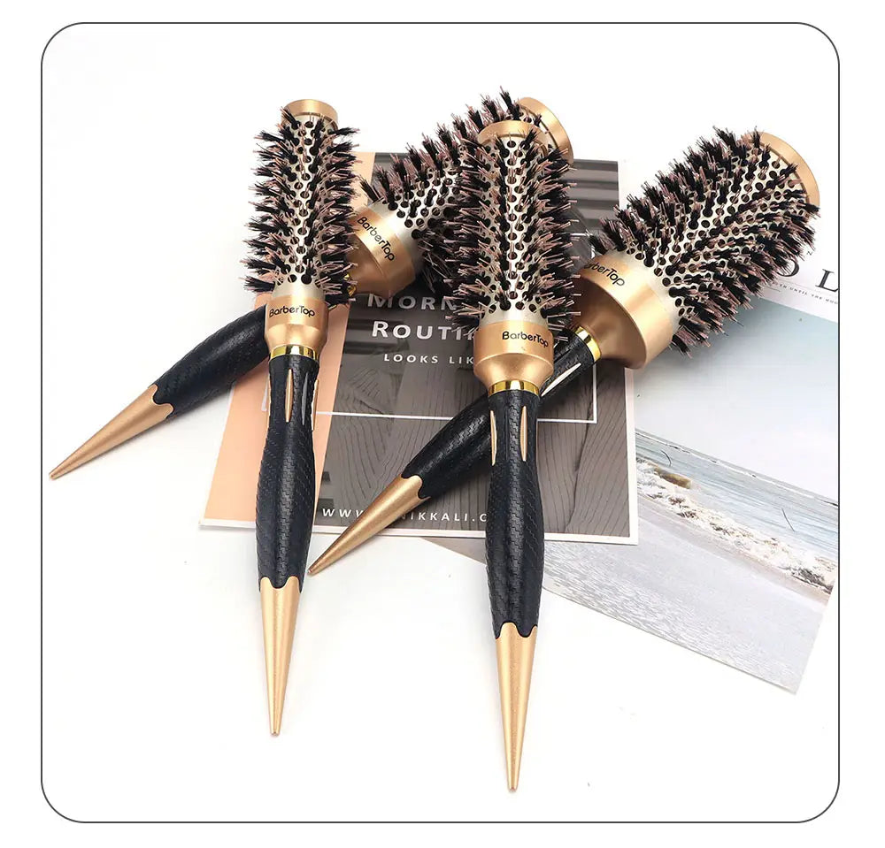 Set of three aluminum round hair styling brushes with black textured handles and gold toned metallic accents for professional hair styling.