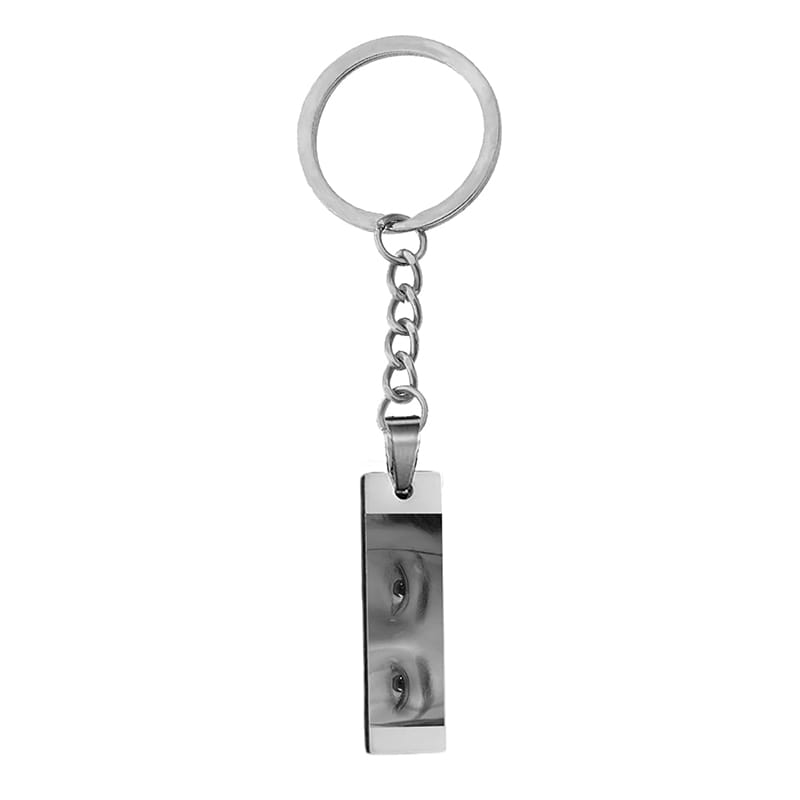 Silver rectangular stainless steel keychain engraved with a black and white photo of eyes for custom personalization.