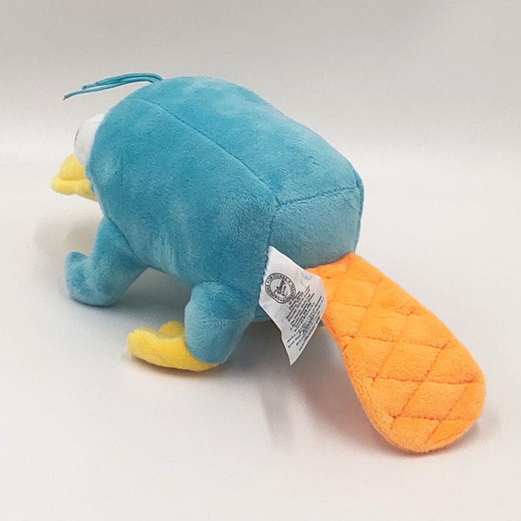 Ein weiches Plüschtier aus Blau und Gelb in Form eines Schleifen-Tauchenten-Plüschtiers mit einem orangefarbenen, gepolsterten/gesteppten Schwanz, entworfen als Kuscheltier.