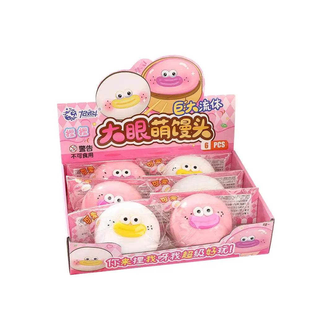rosa und weiße Plüsch-Donut-förmige Enten-Stressabbau-Spielzeuge, langsam aufsteigend und weich, mit Cartoon-Gesichtern, verpackt in einer pinken Präsentationsbox zur Stresslinderung.