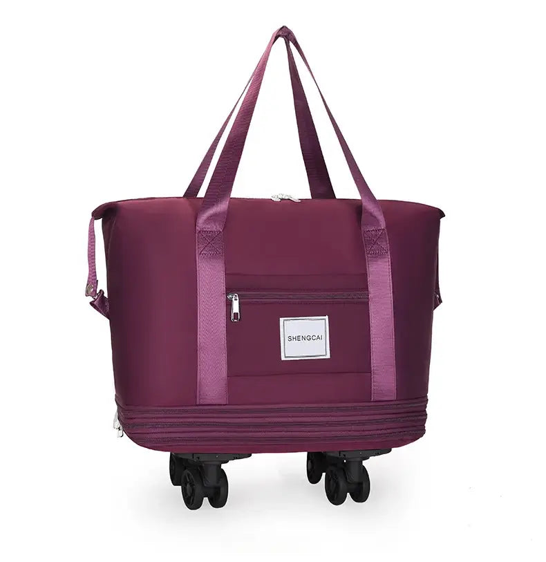Un sac duffel roulant bordeaux à grande capacité, avec des poignées en tissu robustes et une poche avant zippée pour un usage en voyage.