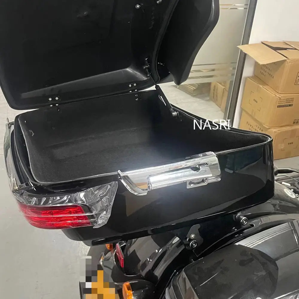 Black glossy Harley Touring trunk support rod rear storage box with chrome handle and sealed edges shown from the backside for 2014-2023 models.